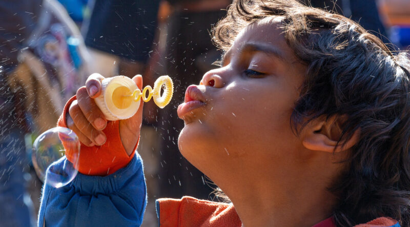 Child blowing bubbles