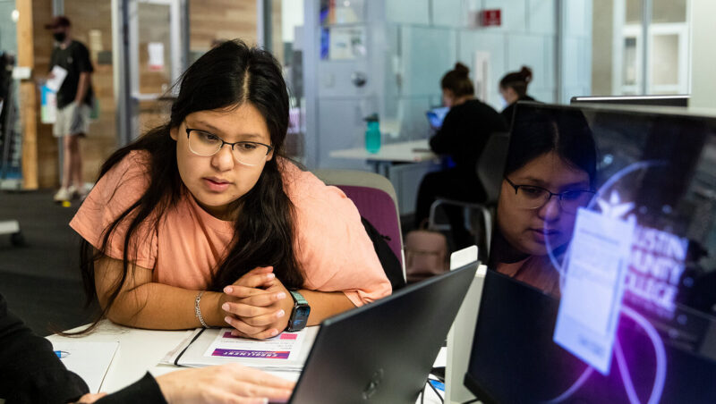 An ACC employee assists and advises a prospective student during the Enrollment Express event on Friday, August 13, 2021, inside the ACCelerator at the Highland Campus.