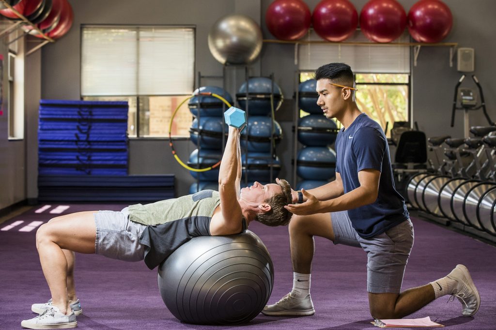 ACC Exercise Science students Paula Korzeniewski and Eric Mendoza pose for the new promotional poster for the program on Thursday, August 9, 2018 at the Riverside campus gym.