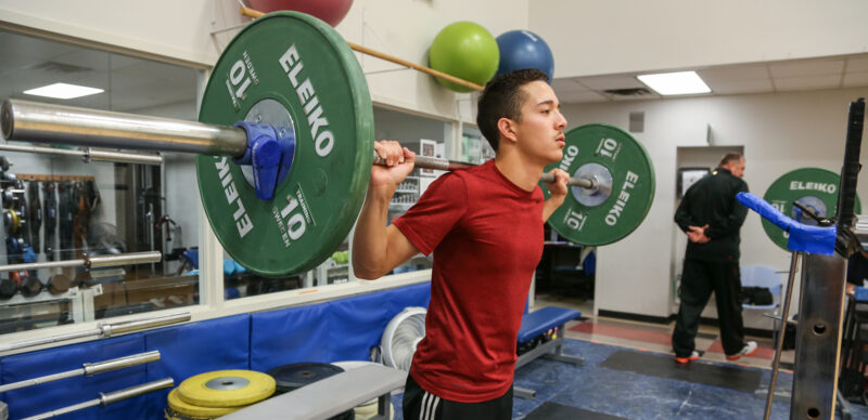 A person lifting weights in a training session